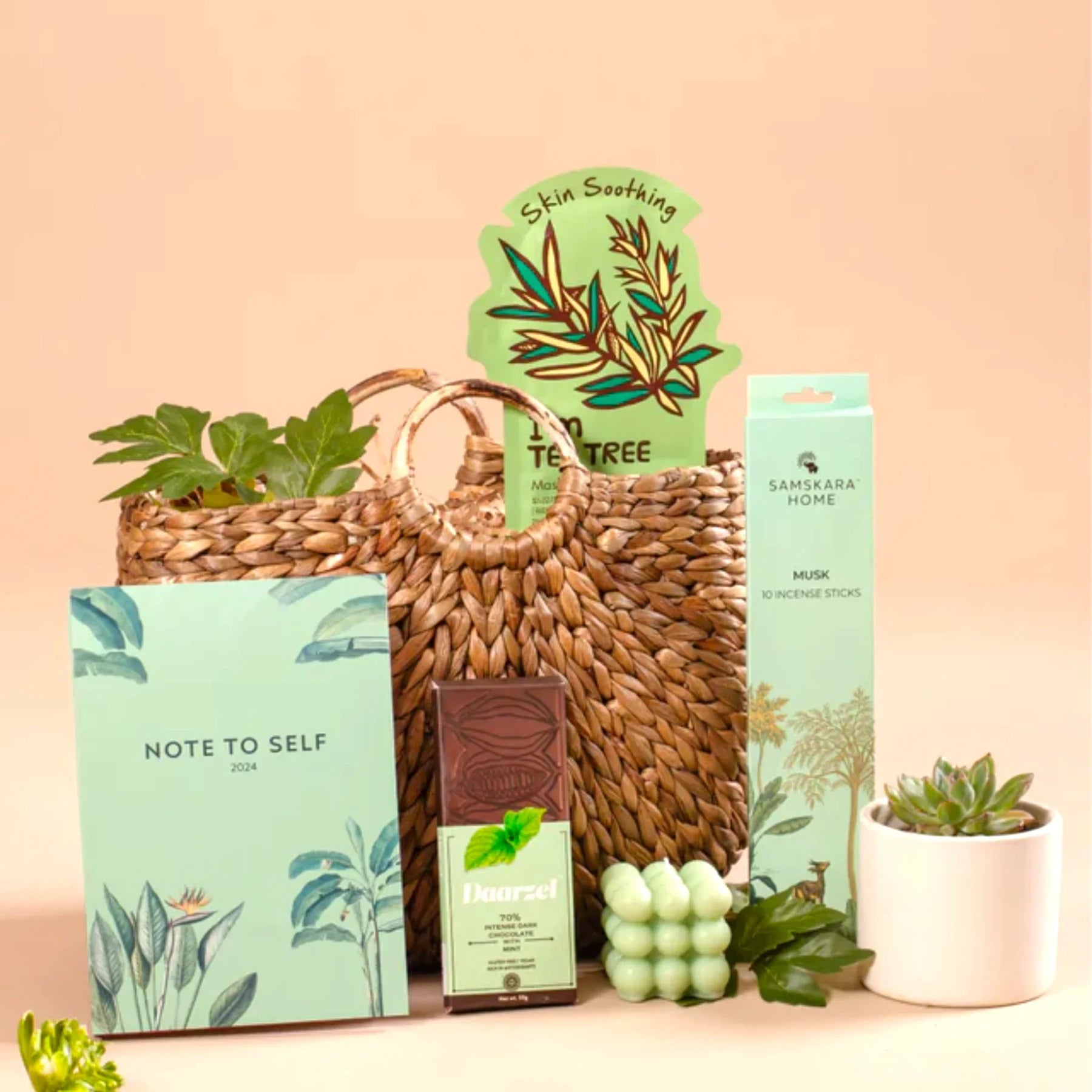 Eco-friendly gift basket with skincare, chocolate, incense, and planner