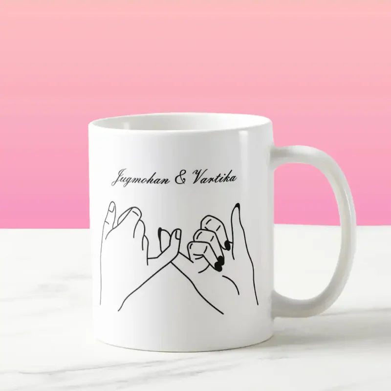 Personalized ceramic mug with pinky promise design and custom names Jugmohan & Vartika. Ideal for Valentine’s Day or romantic gifting.