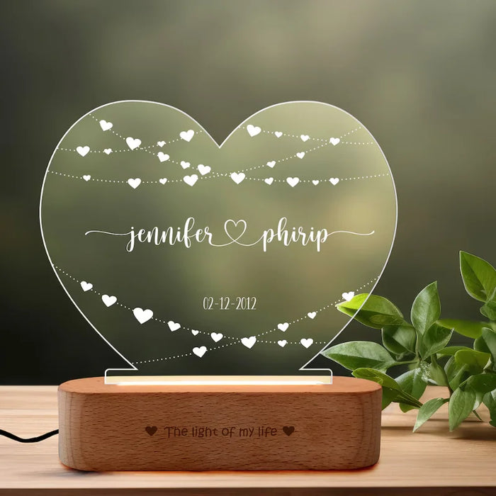Personalized Wedding Lamp with heart-shaped acrylic design on wooden base, engraved with couple's names and wedding date. Ideal for romantic gifts.