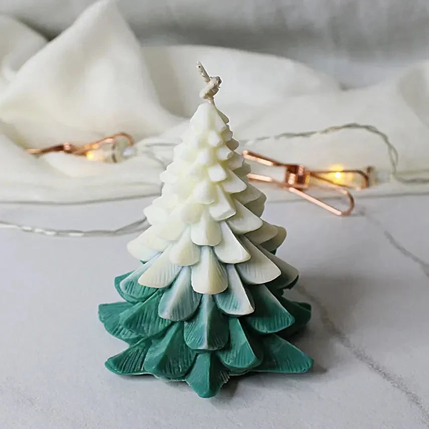 Christmas Tree Scented Candle in green and white gradient with pine-inspired layers, ideal for festive home décor and holiday ambiance.
