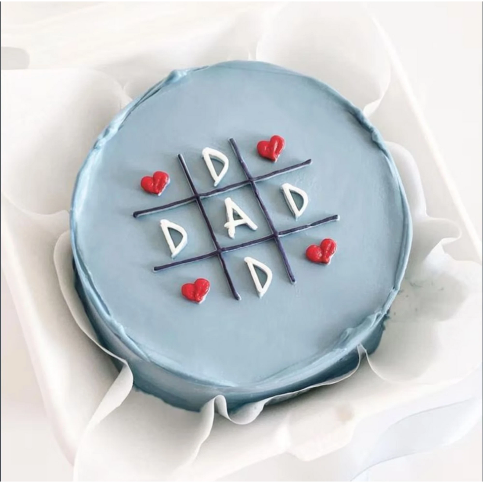 Blue birthday cake with hearts and 'Dad' message