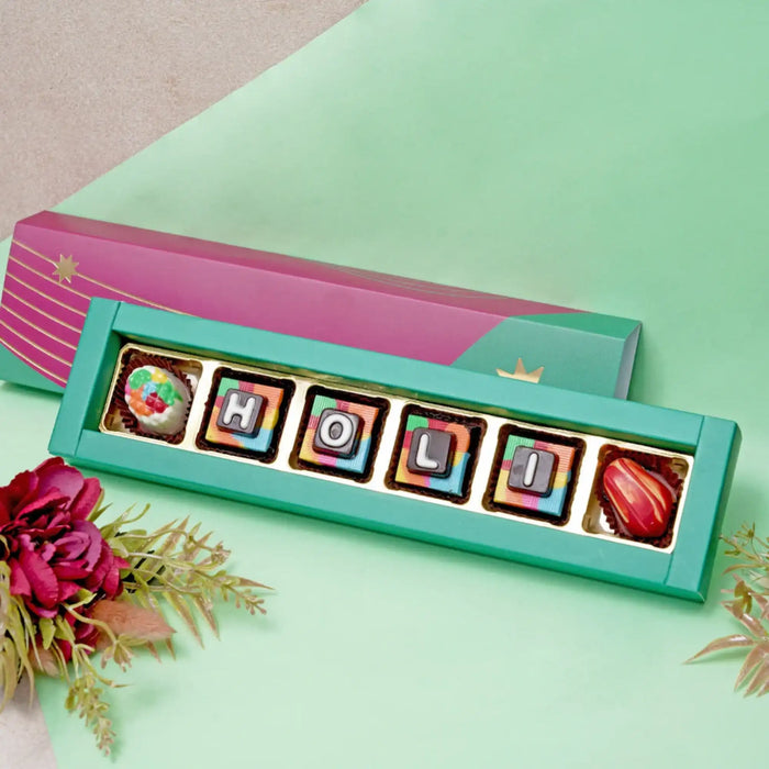 Holi Mini Chocolates Treat box with colorful chocolates spelling HOLI for festive celebration