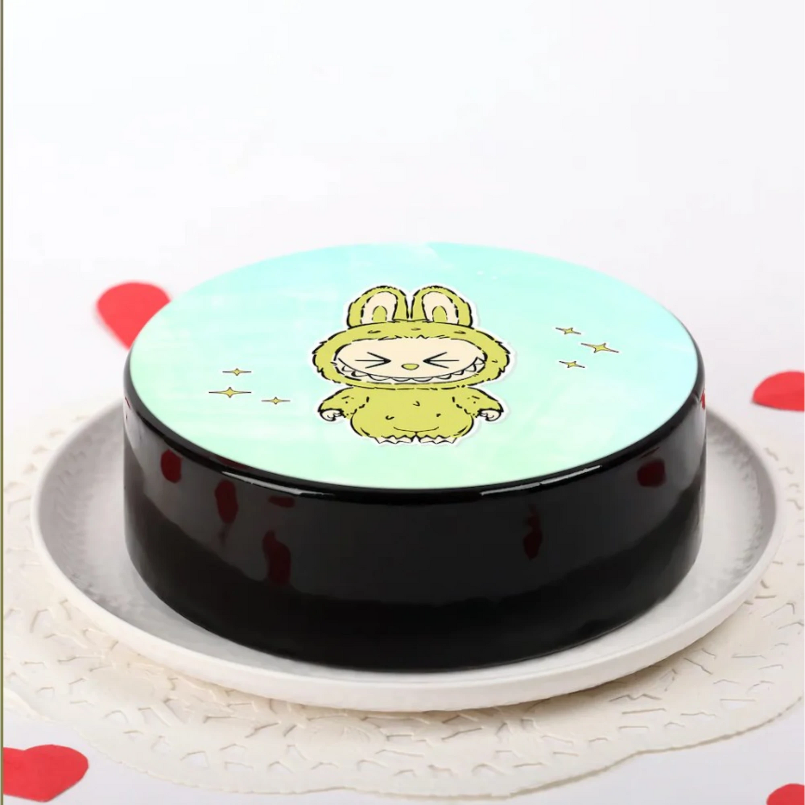 Cute cartoon lion face on round cake with hearts