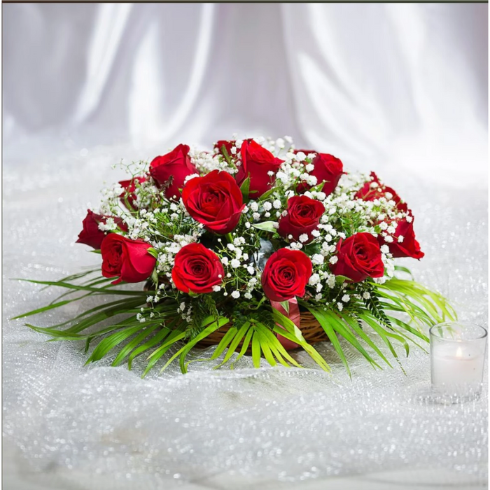 Red roses bouquet with white baby's breath flowers and green leaves