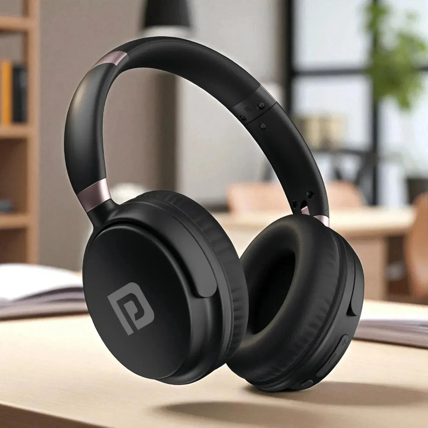 Black headphones on a wooden surface 