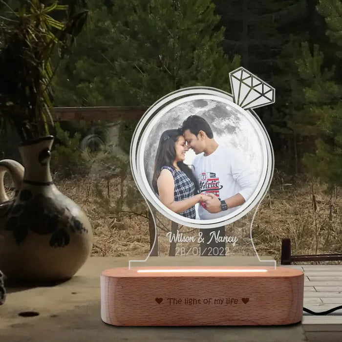 Custom Photo Moon Lamp for Couples with engraved names and date, set on wooden base. Personalized moon lamp ideal for romantic home décor.