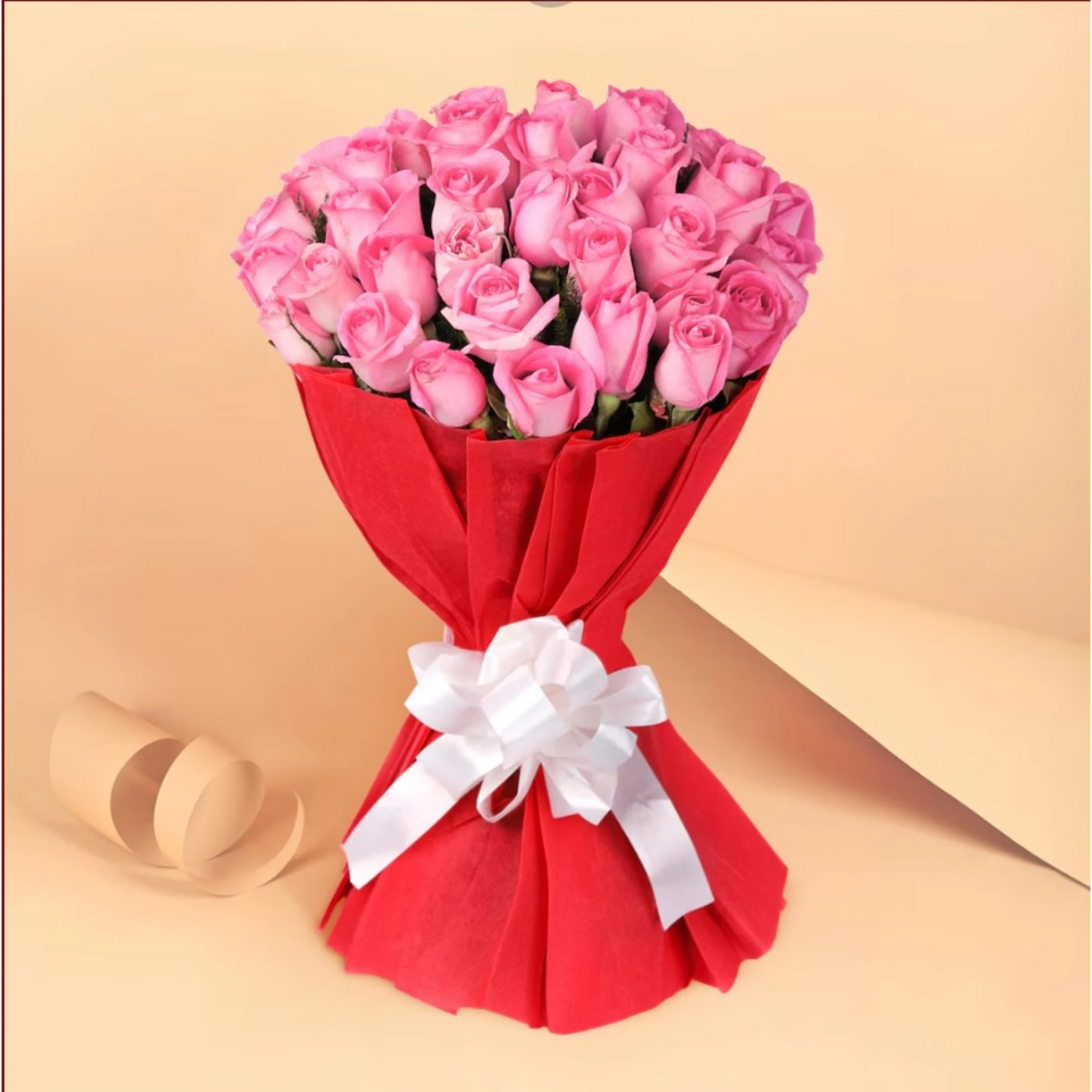 Pink roses bouquet with red wrapping