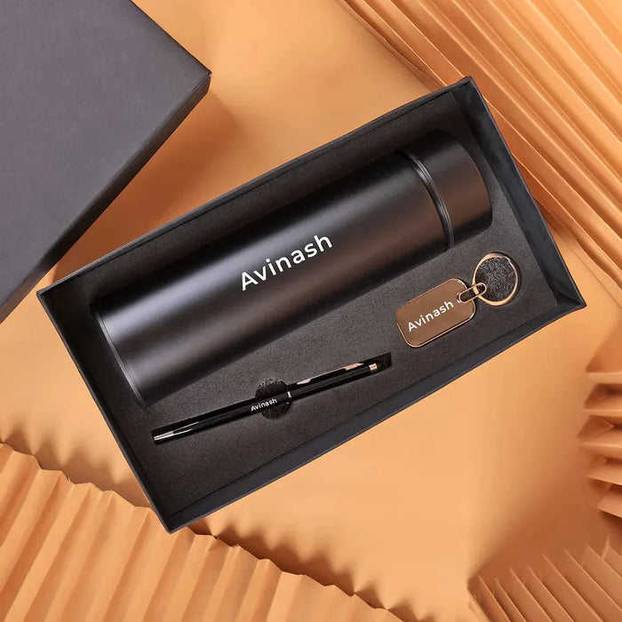 Custom Pen Keychain & Bottle Gift Set with name 'Avinash' engraved on black thermal bottle, pen, and keychain. Ideal personalized gift for men.