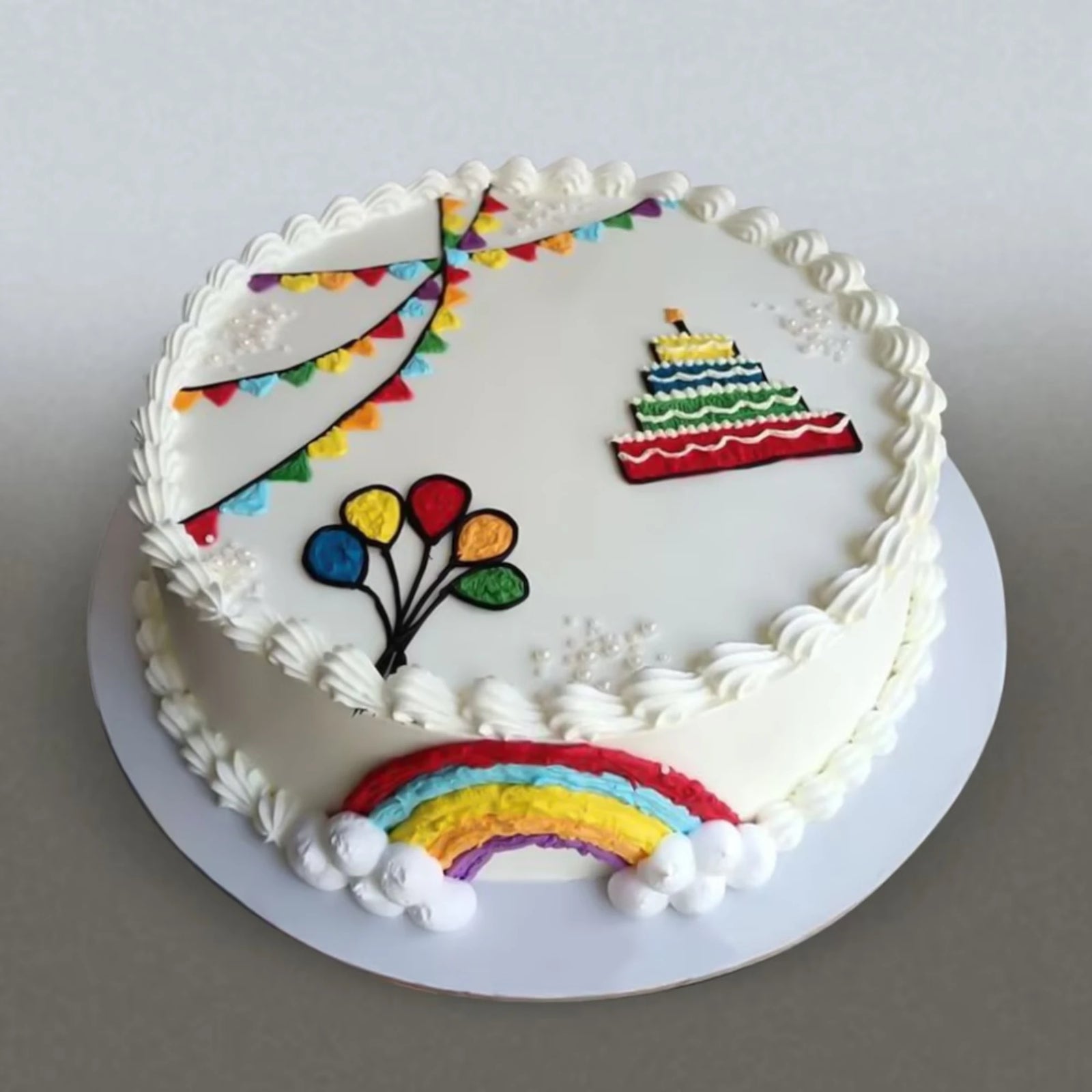 Rainbow Delight Cream Cake with colorful rainbow design