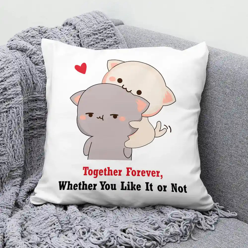 Valentines Cushion Gift - Together Forever featuring cute cartoon cats hugging with heart, placed on a grey knitted throw blanket. Ideal for home décor.