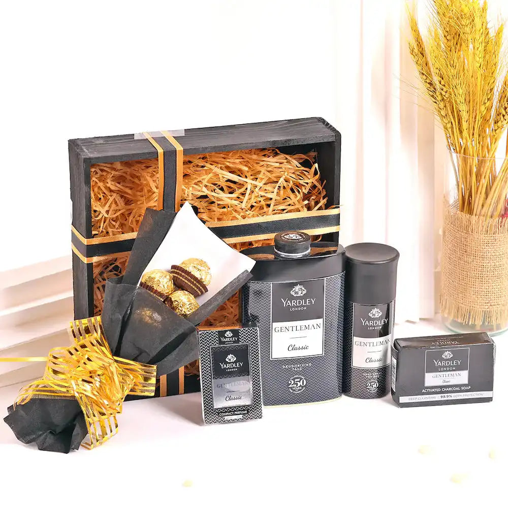 Yardley Black Kit for Men - Gentleman Range Gift Pack featuring charcoal soap, talc, shaving cream, body spray, and chocolates in a wooden box.