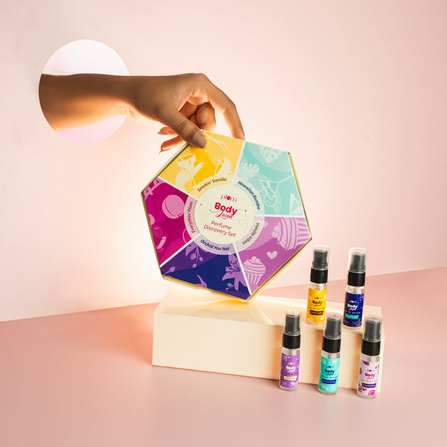 Perfume Discovery Set of 5 - perfume discovery set | Explore scents featuring colorful hexagonal box and five mini spray bottles for travel use.